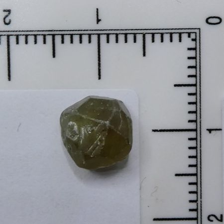 Ritka, fnyes zld Demantoid grnt svny szemcse Nambibl. 0,67 gramm.